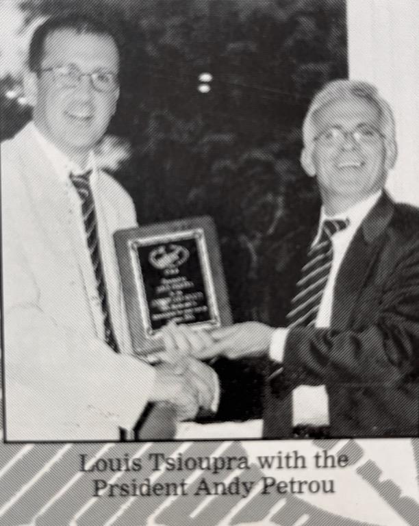 Captain receiving his momento from President Andy Petrou